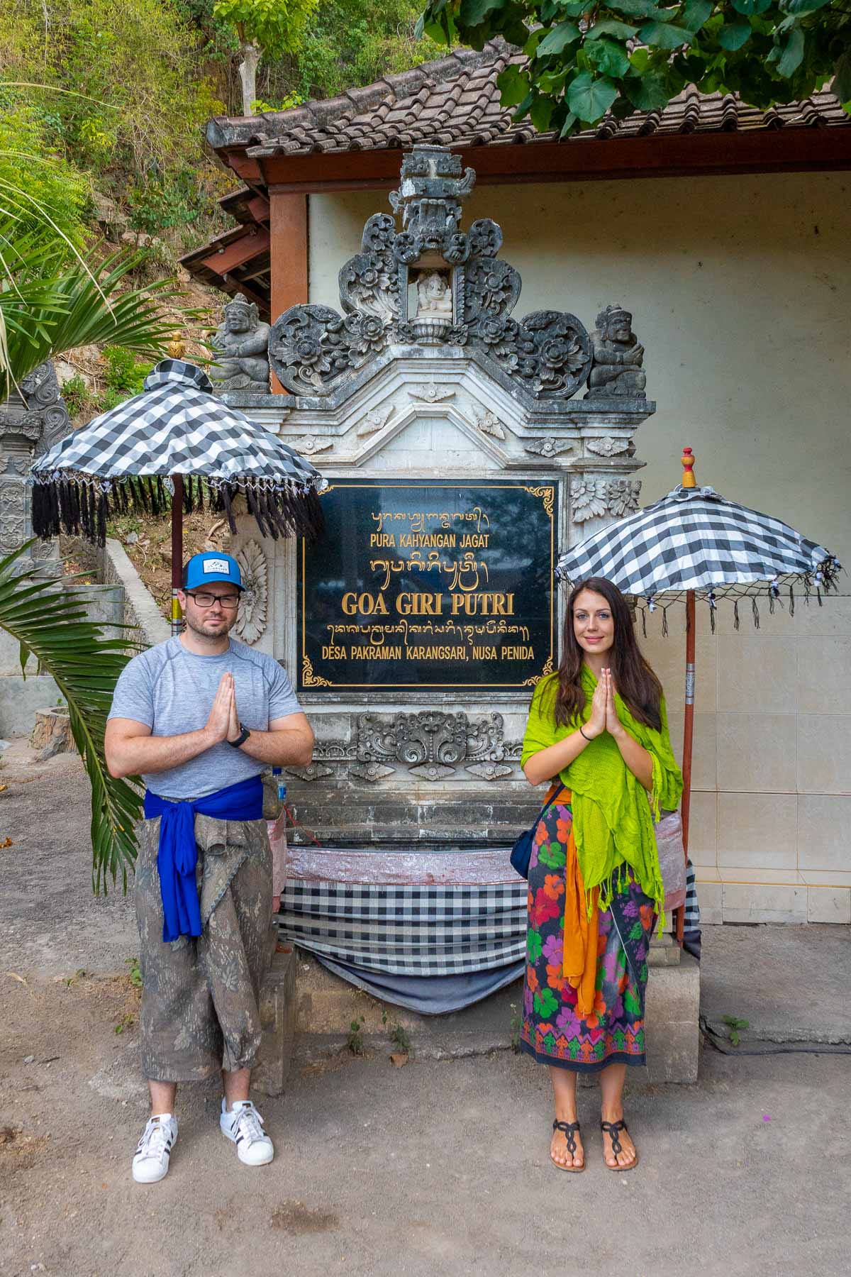 Girl and a boy standing at Goa Giri Putri, Nusa Penida