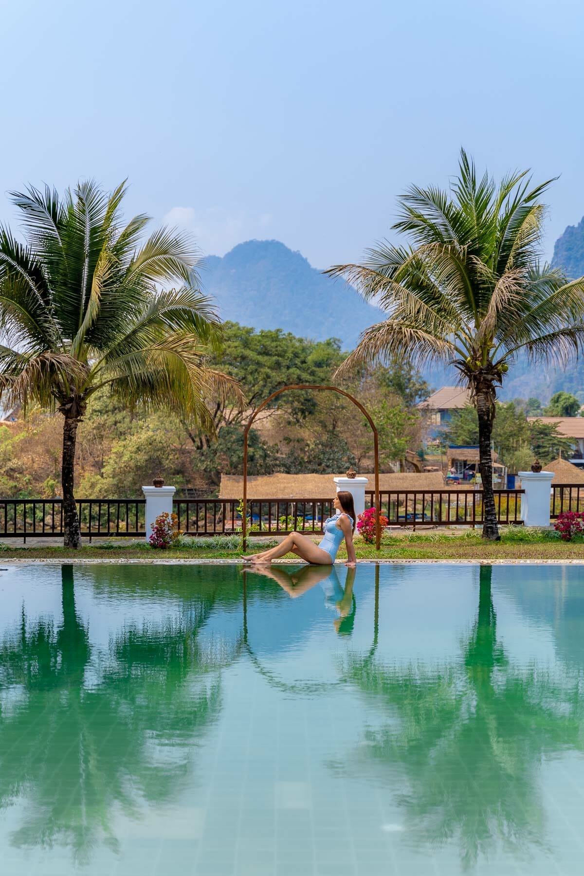 Girl by the pool at Riverside Boutique Resort Vang Vieng
