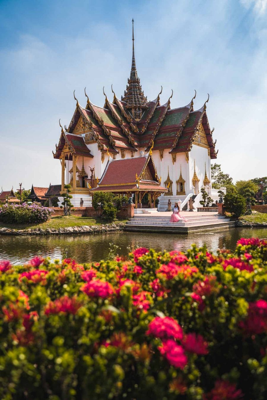 Beautiful temple with flowers in the foreground at the Ancient Siam Bangkok