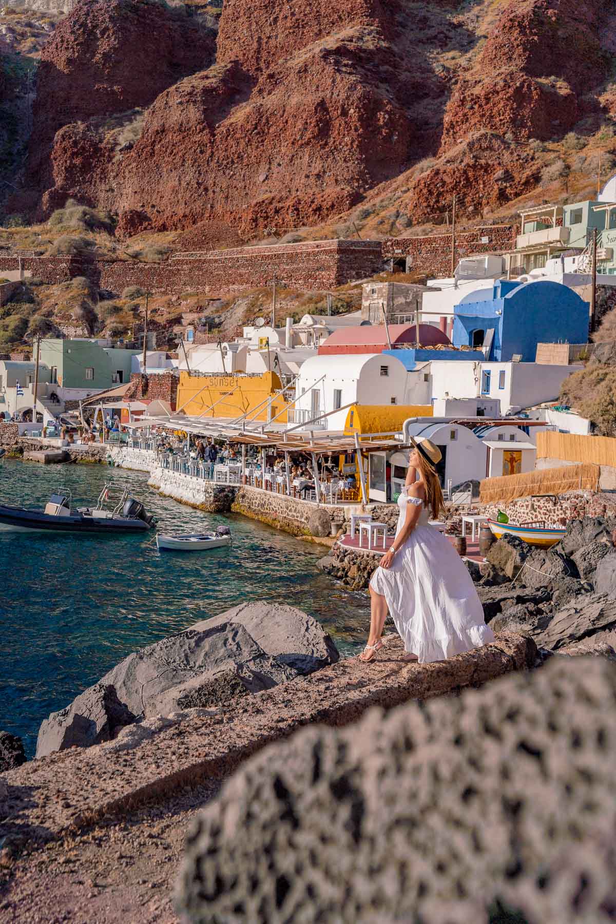 Girl in white dress at Ammoudi Bay, Santorini