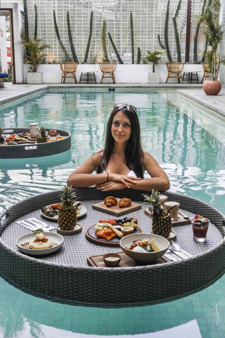 Girl with a floating breakfast at Cabina Bali