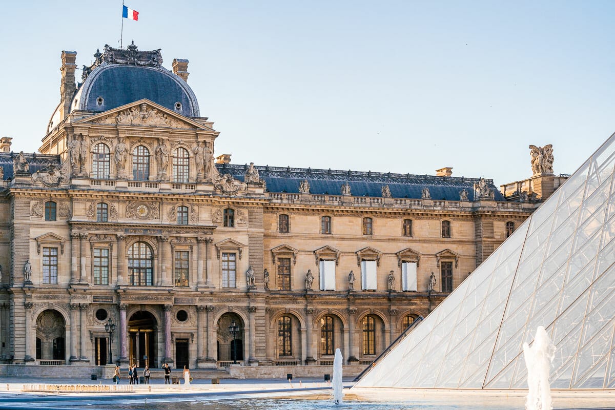 The courtyard with the glass pyramids at Musée du Louvre in Paris