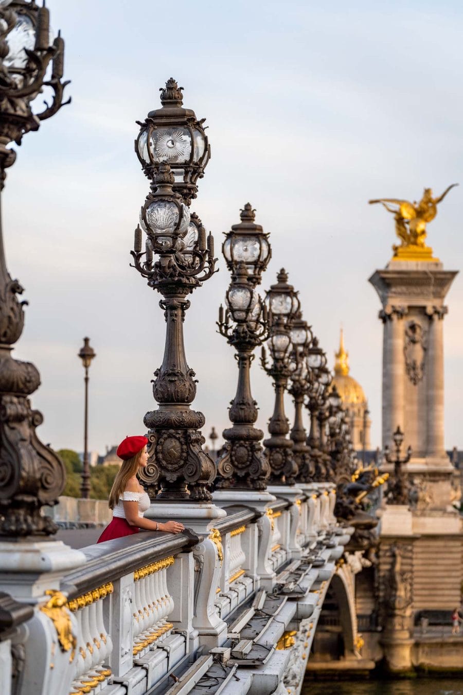 Girl standing at Pont Alexandre III, one of the best Paris Instagram spots