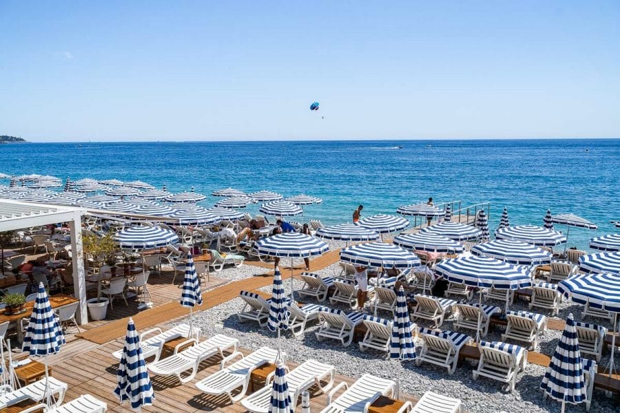 The famous white-blue parasols at Ruhl Plage in Nice, France