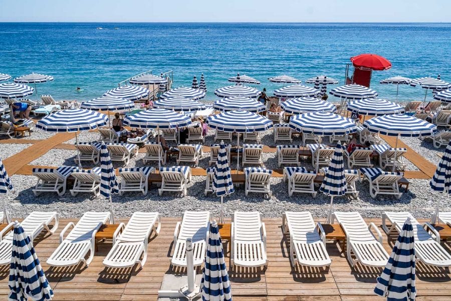 The famous white-blue parasols at Ruhl Plage in Nice, France