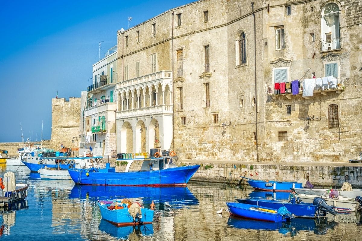 Blue boats in the seaport of Monopoli, Italy