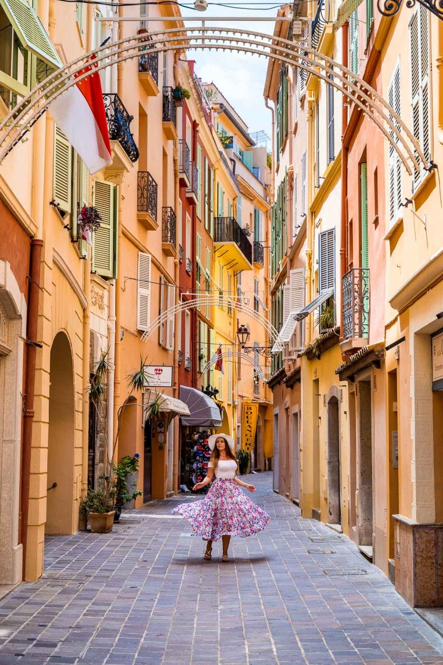 Colorful houses in Monaco Old Town with girl in the middle