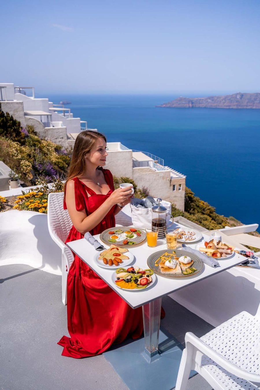 Girl having breakfast at Kasimatis by La Perla in Imerovigli, Santorini