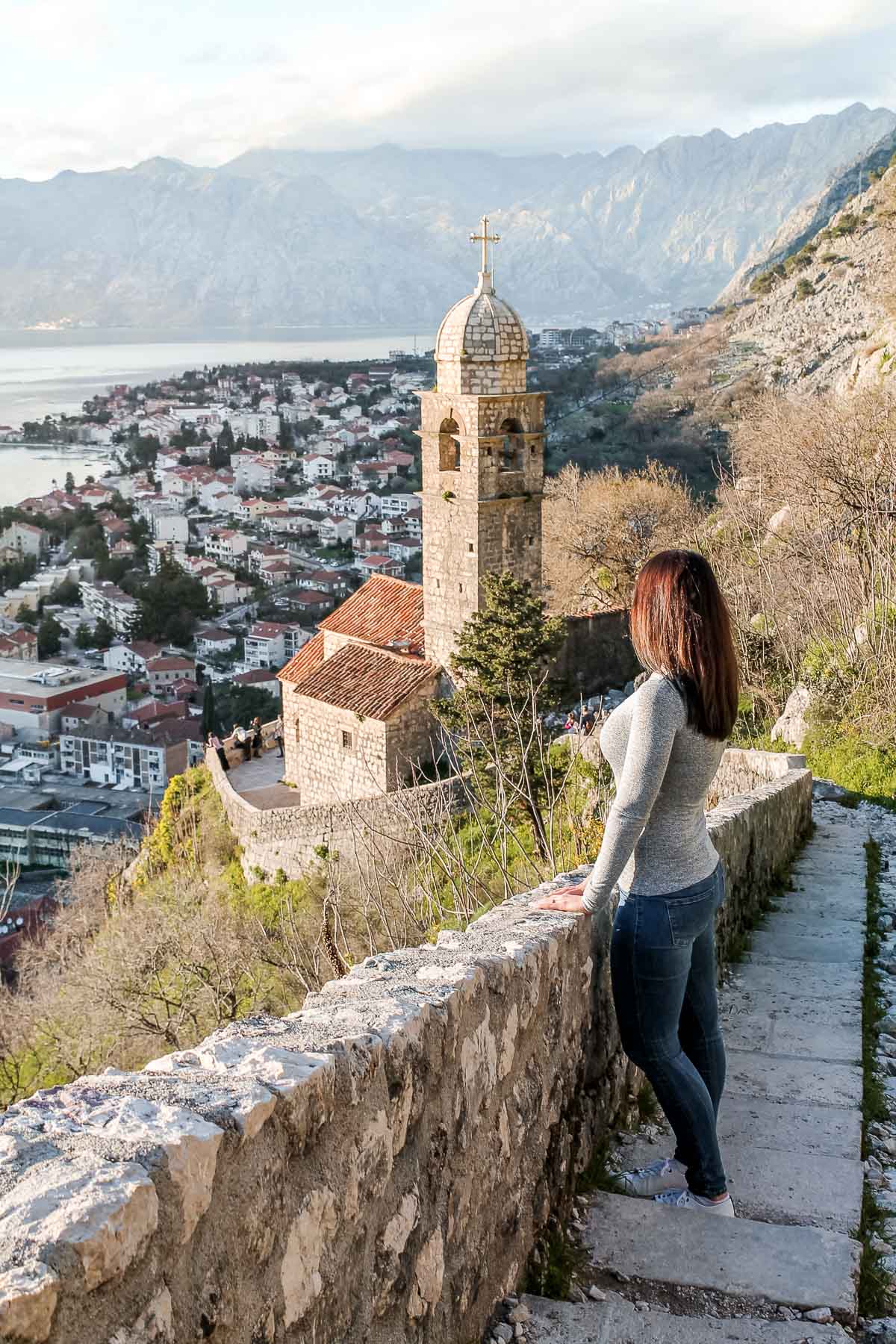 Girl standing on a stairway in Kotor, Montenegro
