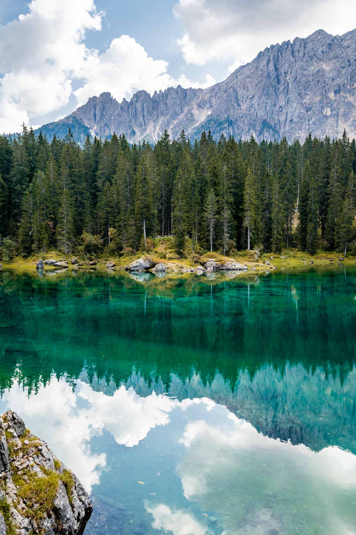 Reflections at Lago di Carezza, one of the most beautiful lakes in the Dolomites