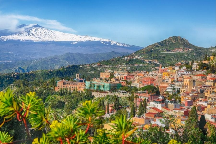 Panoramic view of Taormina and the Etna volcano in Sicily, Italy