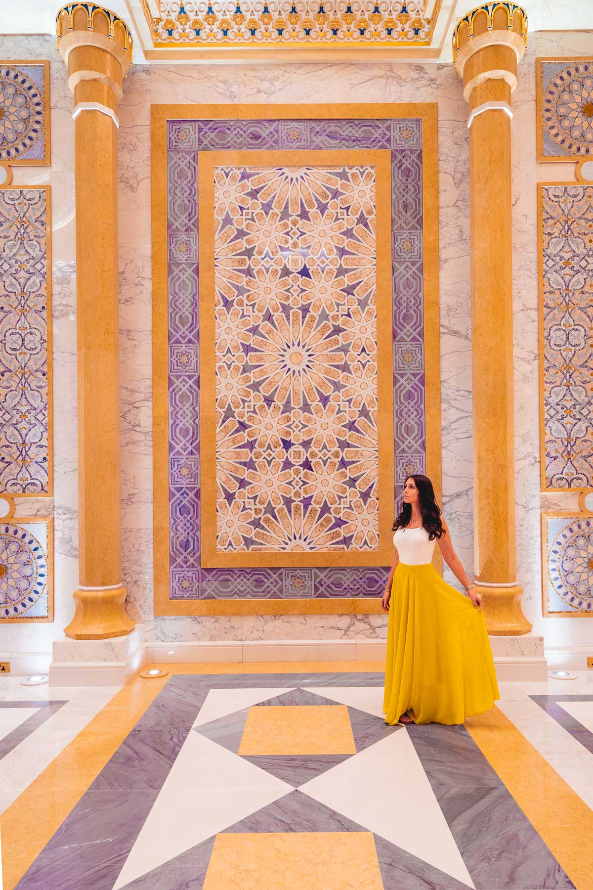 Girl in a yellow skirt standing in Qasr al Watan Palace, Abu Dhabi