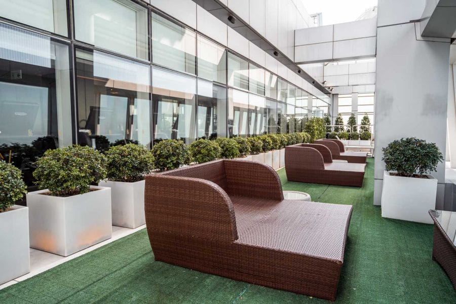 Outdoor terrace on the 118th floor with chairs and green plants