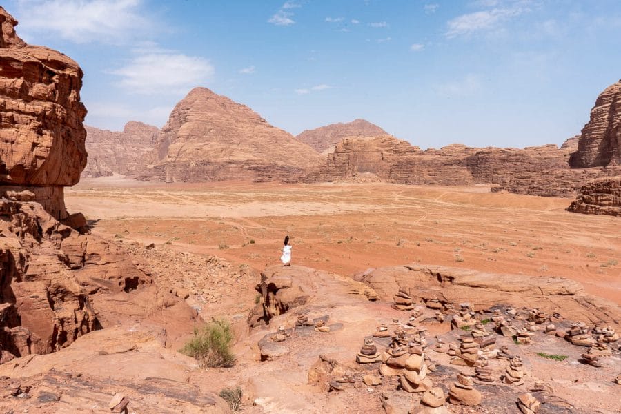 Girl in a white dress looking at the view in the Wadi Rum, Jordan