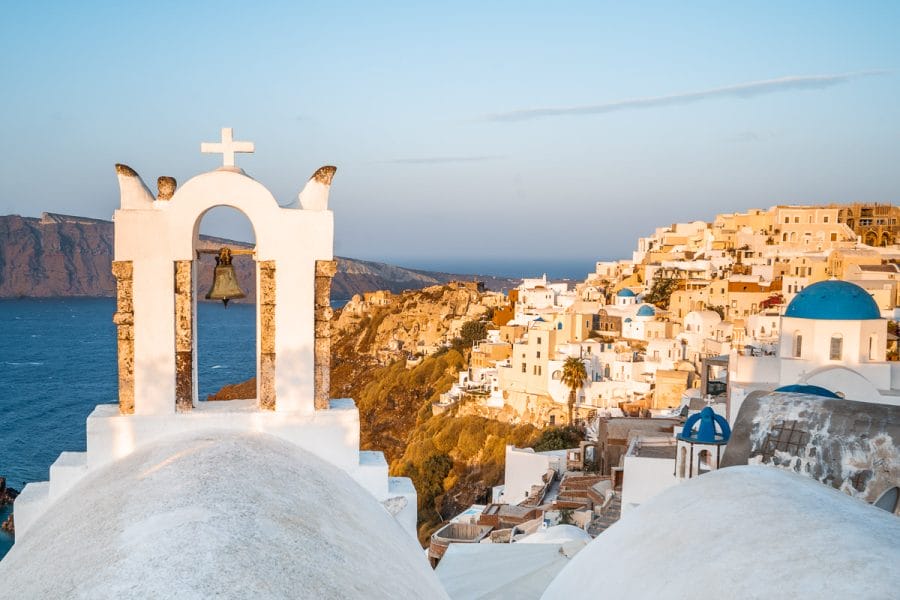 Sunrise over the white-washed buildings in Oia, Santorini