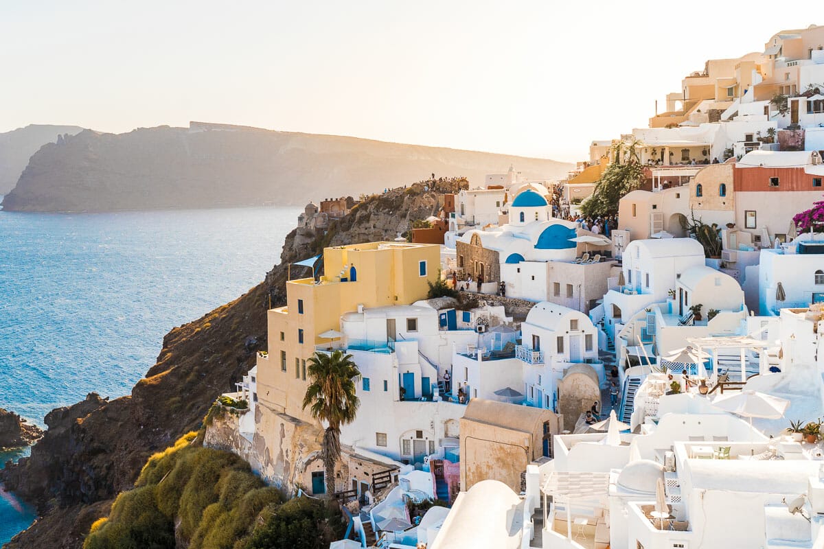 The postcard perfect view with the white washed cliffside buildings in Oia, Santorini