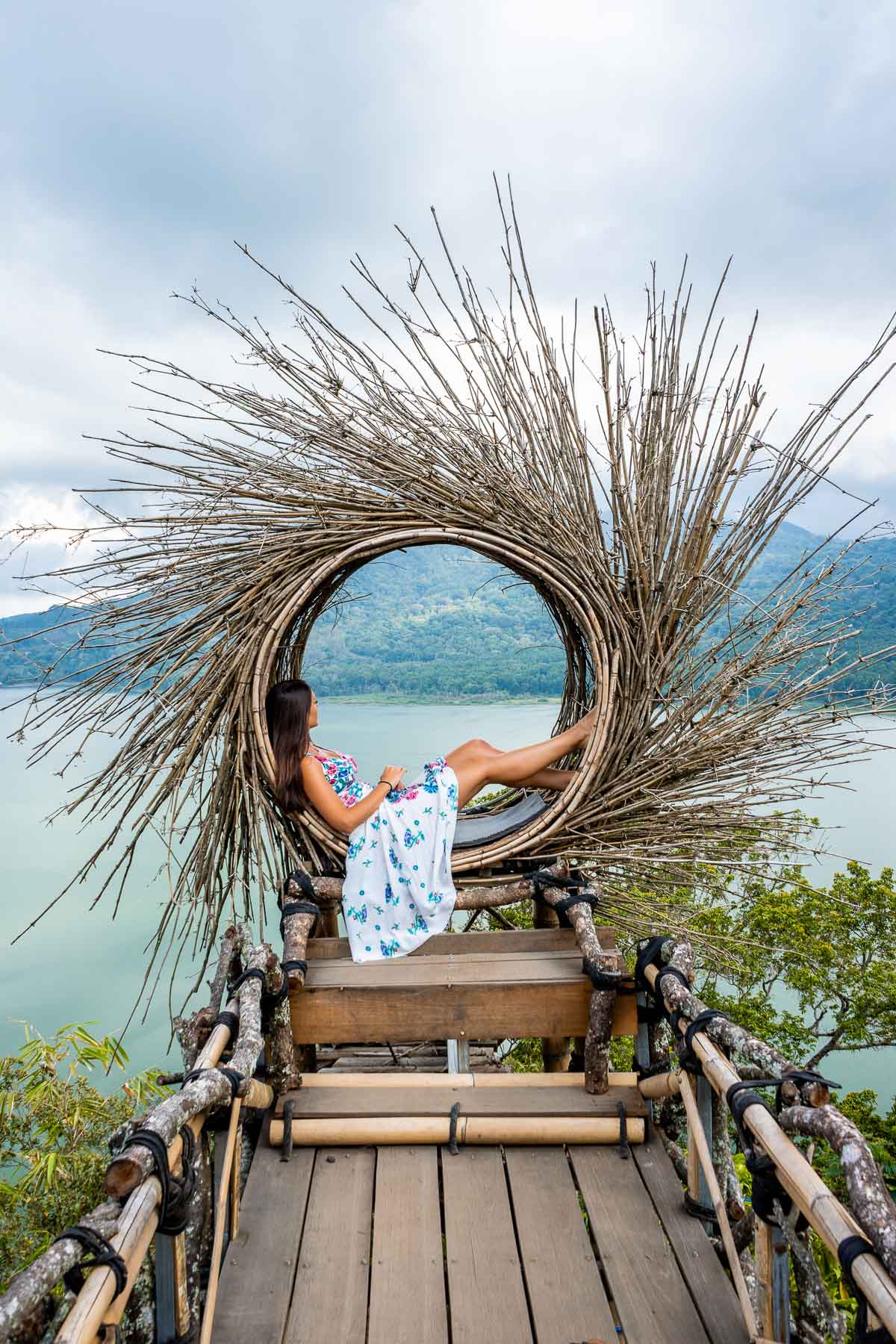 Girl sitting in a bamboo lookout at Wanagiri Hidden Hills in Bali