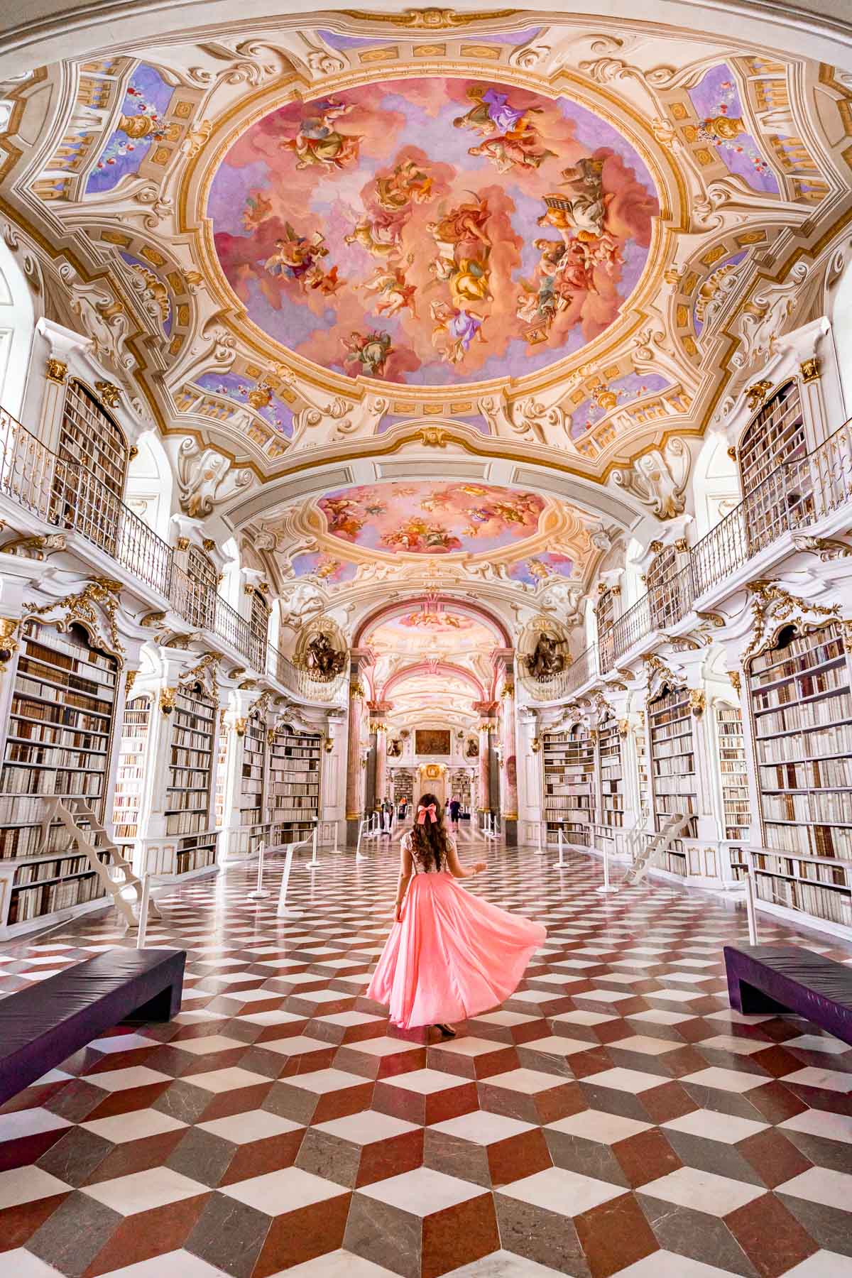 Girl in a pink skirt inside Admont Abbey Library, Austria