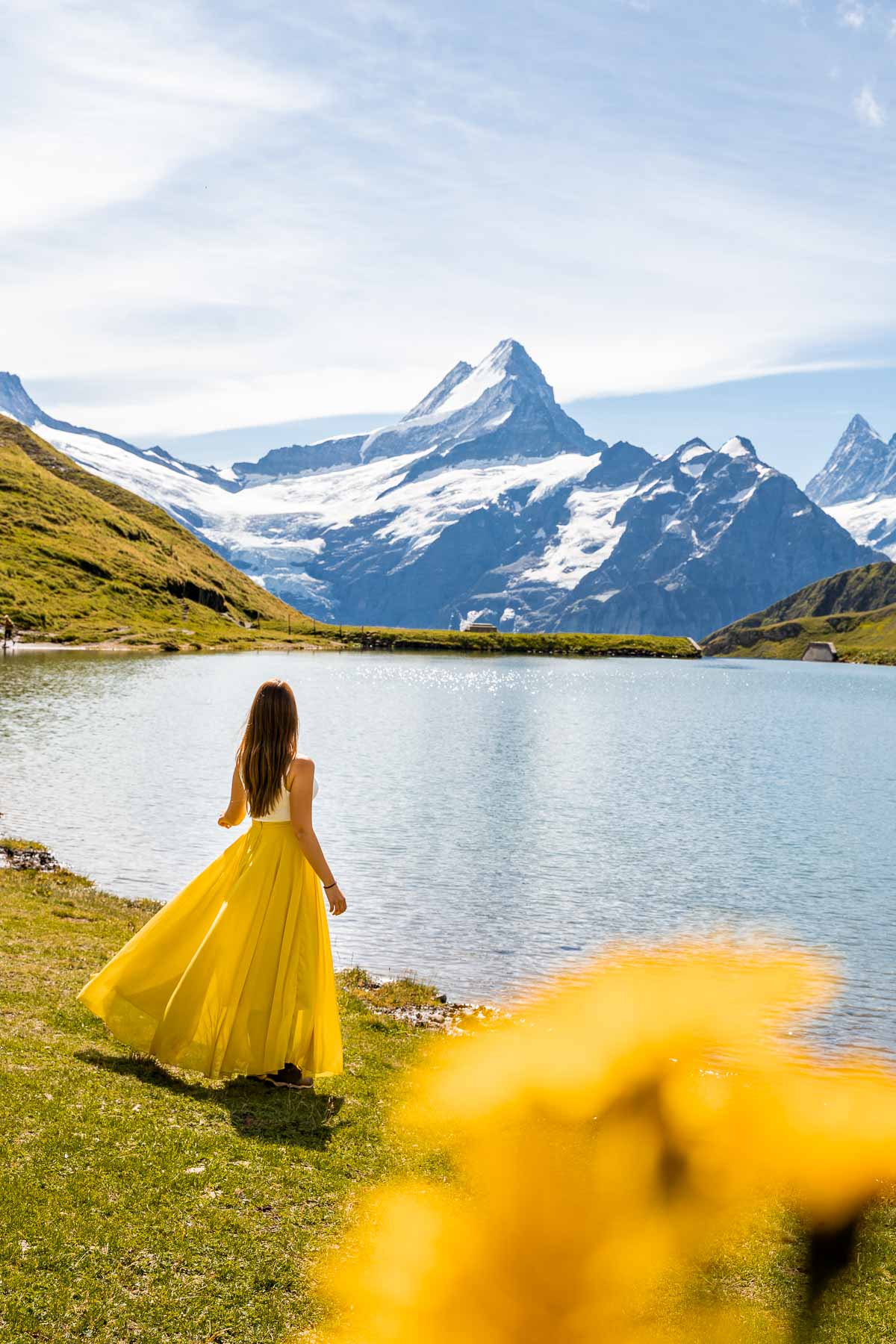 Girl in a yellow dress in front of Bachalpsee, Switzerland