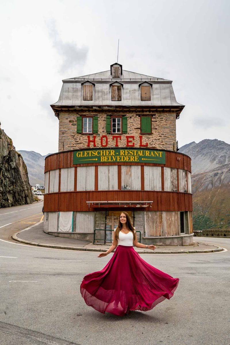 Girl in a red skirt in front of Belvedere Furka, Switzerland