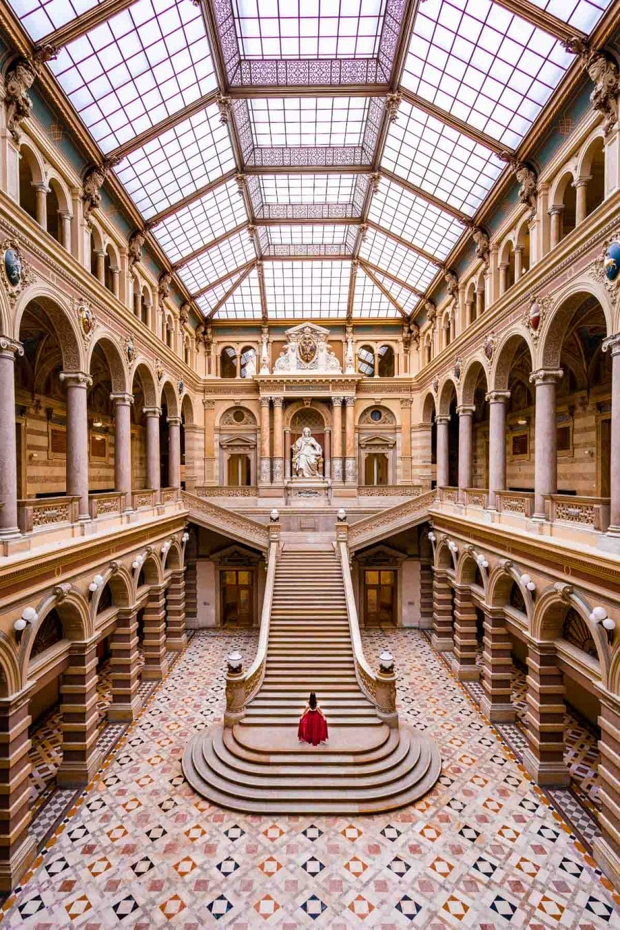 Girl in a red skirt inside the Palace of Justice, one of the best Vienna Instagram spots