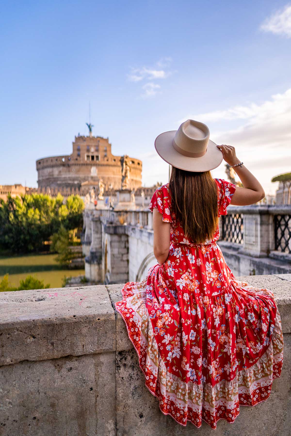 Girl in a red floral skirt in front of Castel Sant' Angelo, Rome