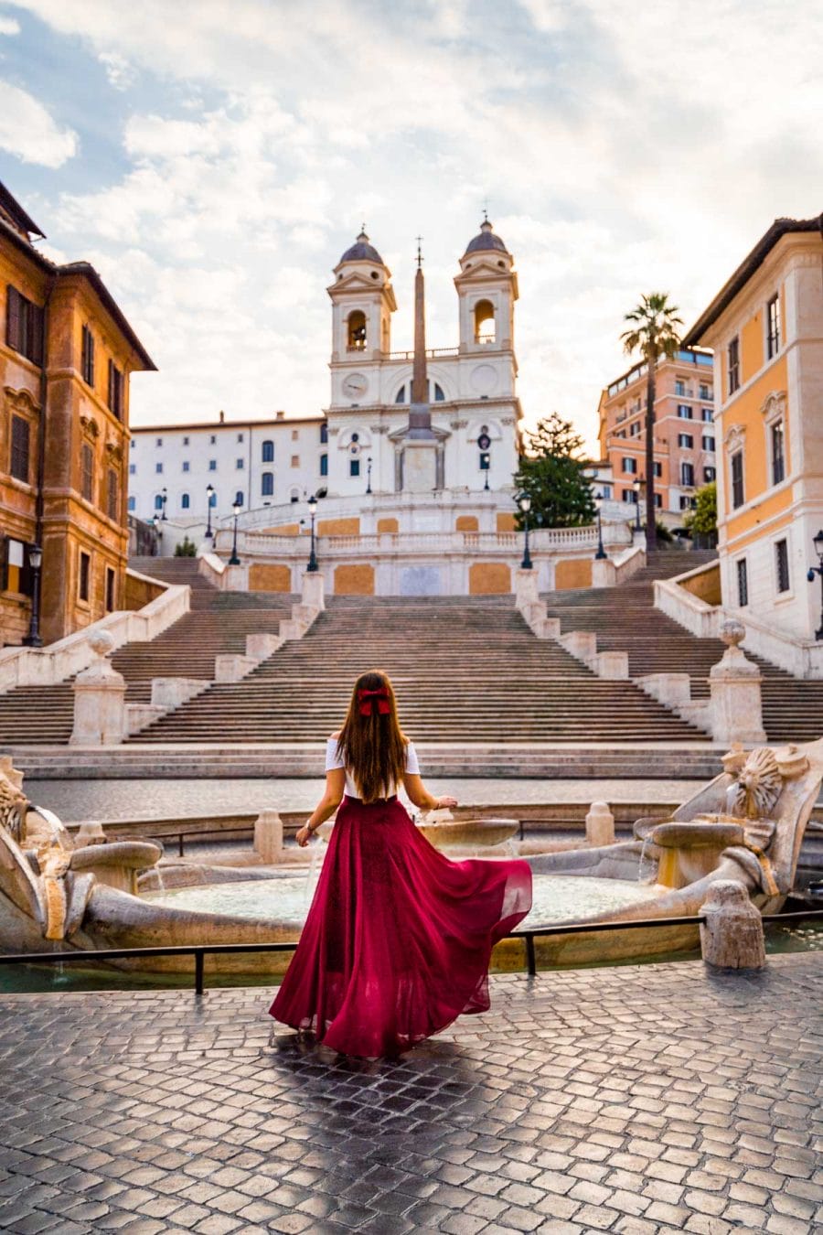Girl in a red skirt in front of the Spanish Steps in Rome, Italy