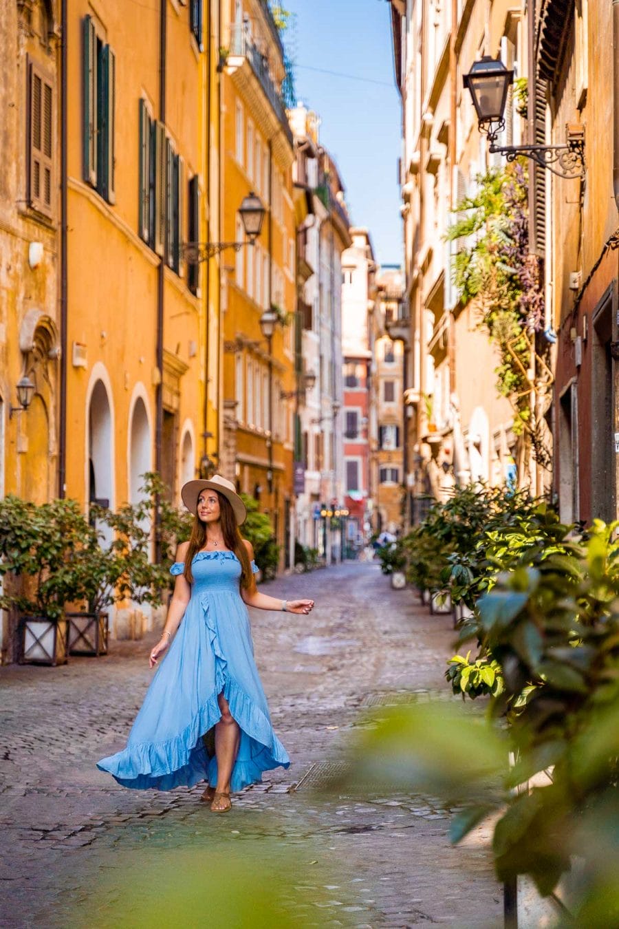 Girl in a blue dress in Via dei Coronari, one of the most instagrammable places in Rome