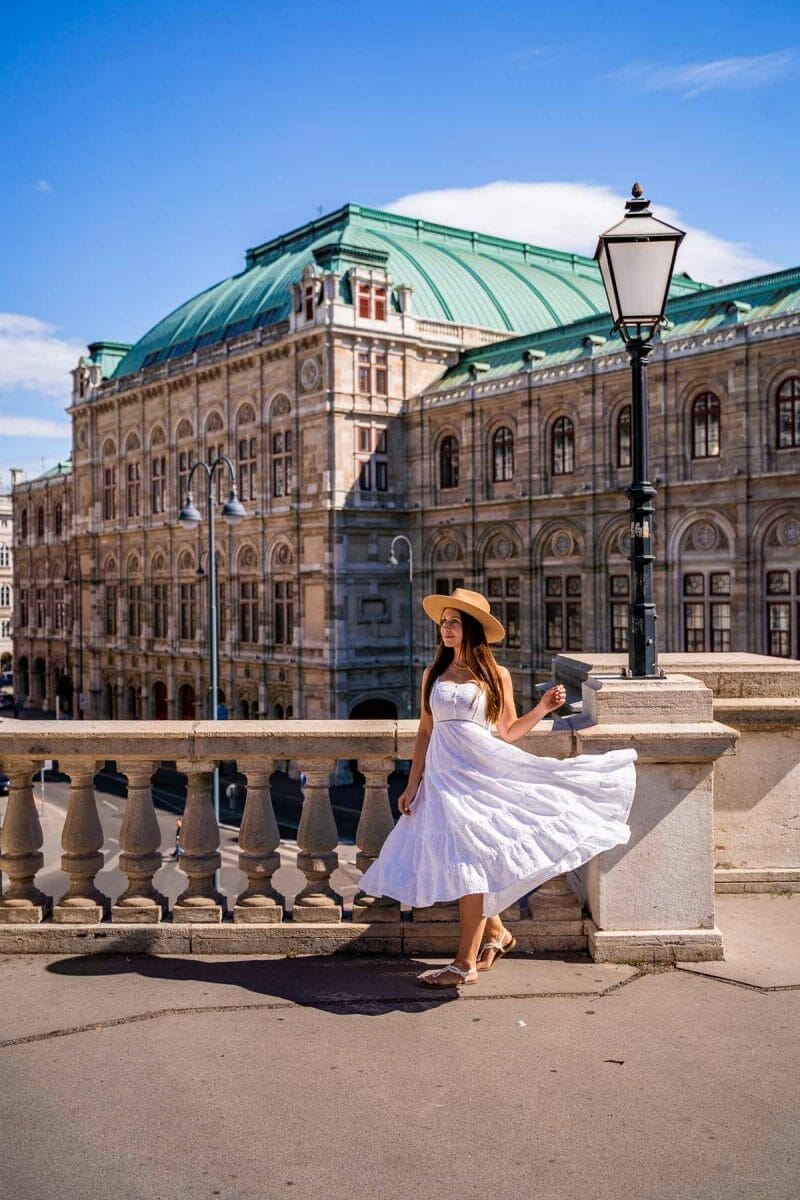 Girl in a white dress in front of the Vienna State Opera, one of the most instagrammable places in Vienna