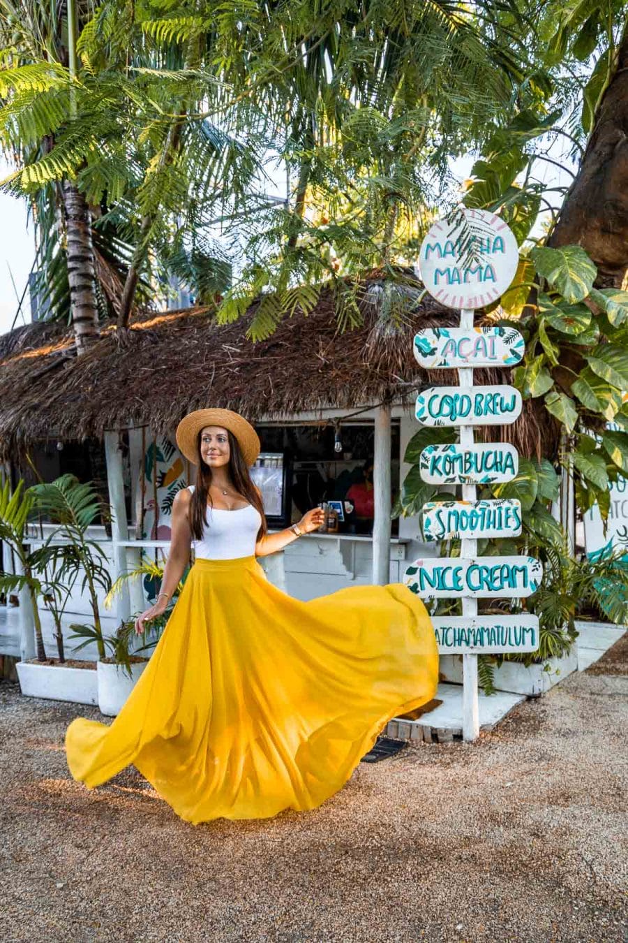 Girl in yellow skirt in front of Matcha Mama Tulum