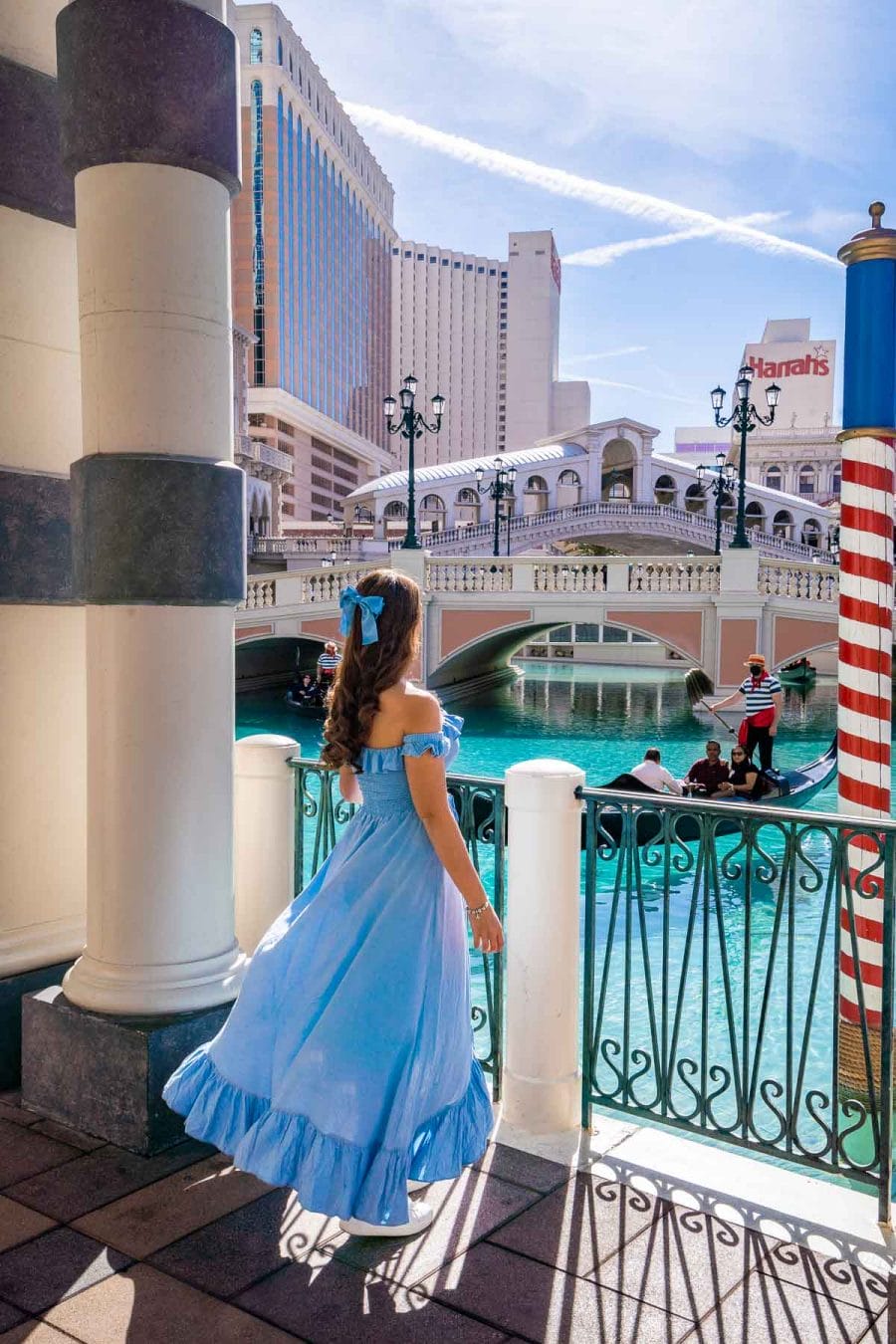 Girl in blue dress in front of the outdoor canals at The Venetian Las Vegas