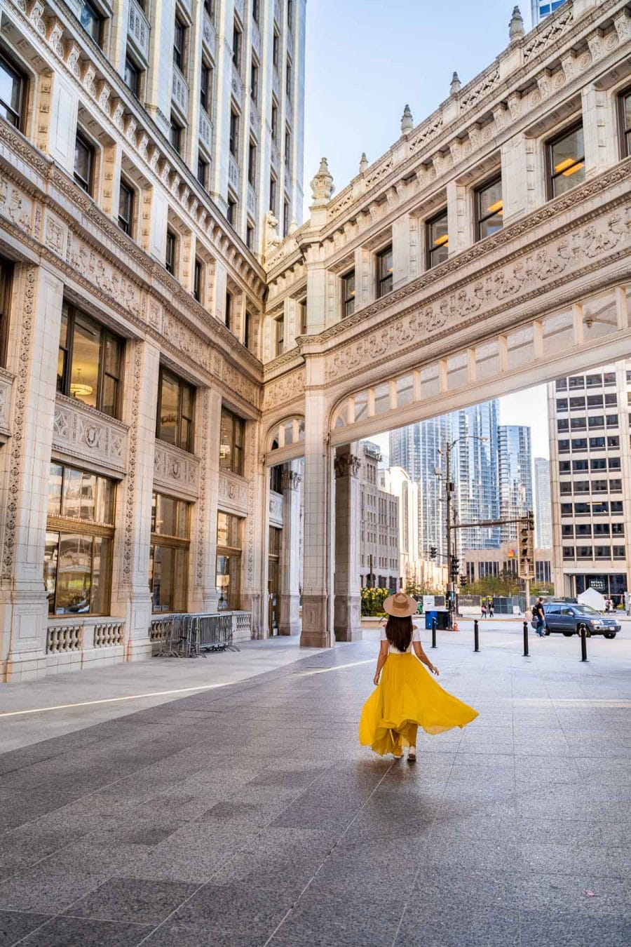 The Wrigley Building Chicago with girl in yellow skirt