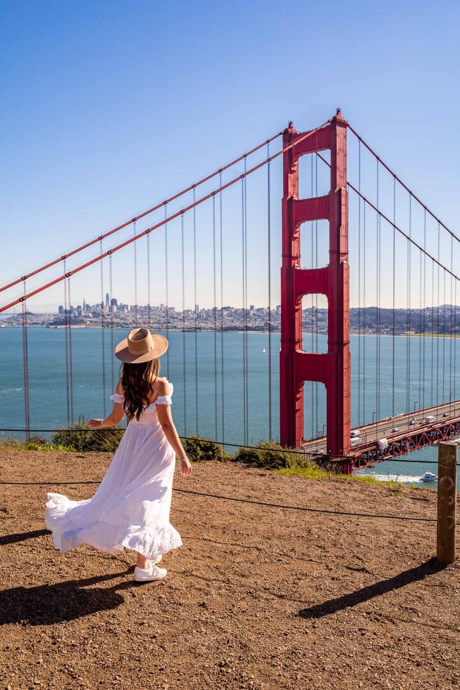 Girl in white dress at Battery Spencer, one of the best Instagram spots in San Francisco