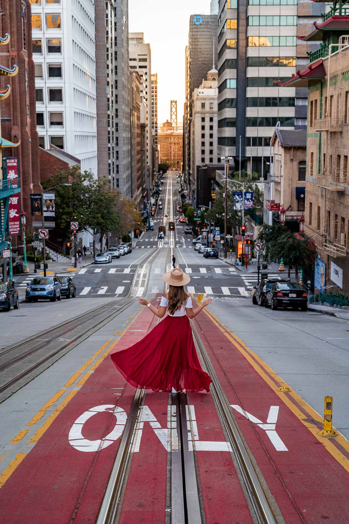 Girl in red skirt on California in Street San Francisco
