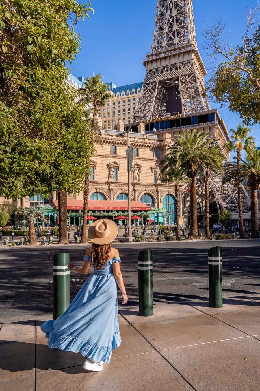 Girl in white dress in front of the Eiffel Tower at Paris Las Vegas