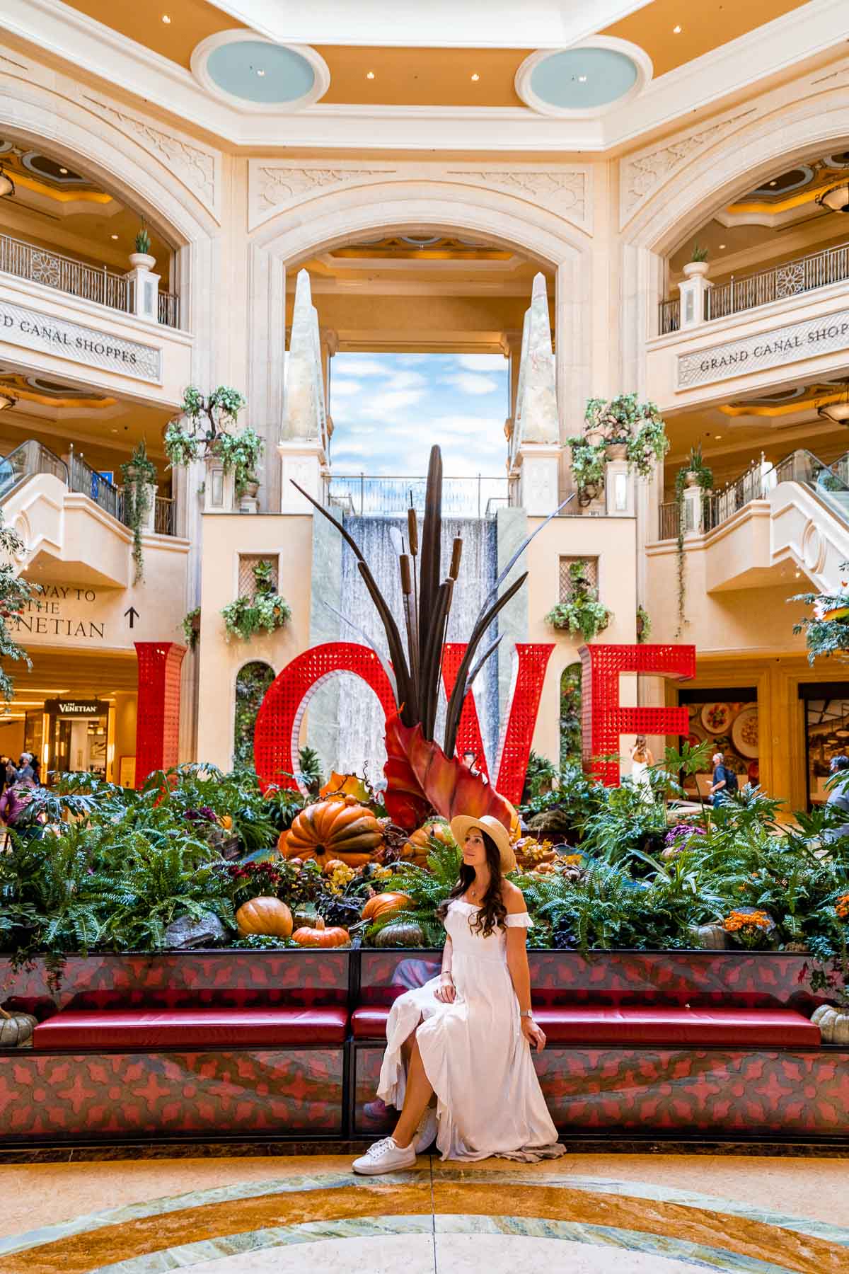 Girl in white dress sitting inside the Grand Canal Shoppes at The Venetian Las Vegas