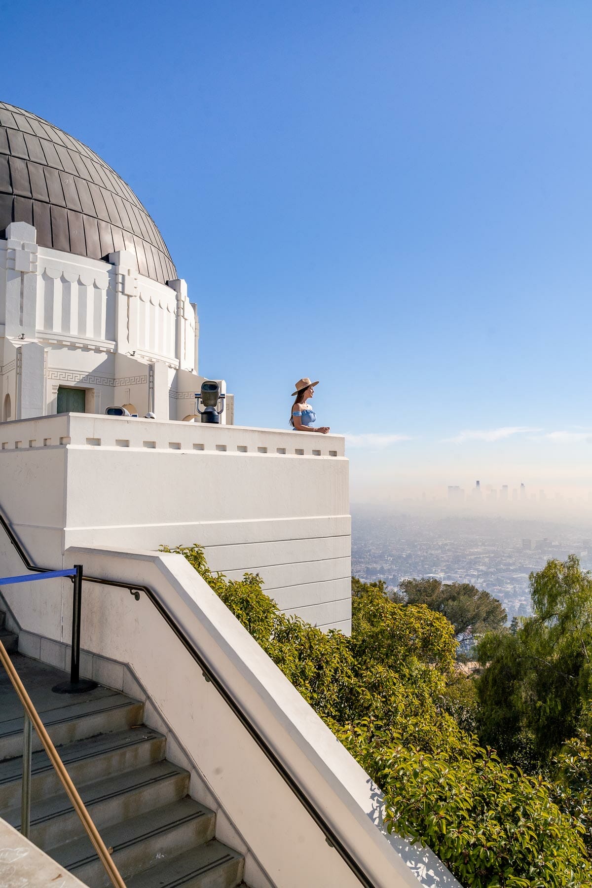 Girl in blue dress at Griffith Observatory, one of the best LA Instagram spots