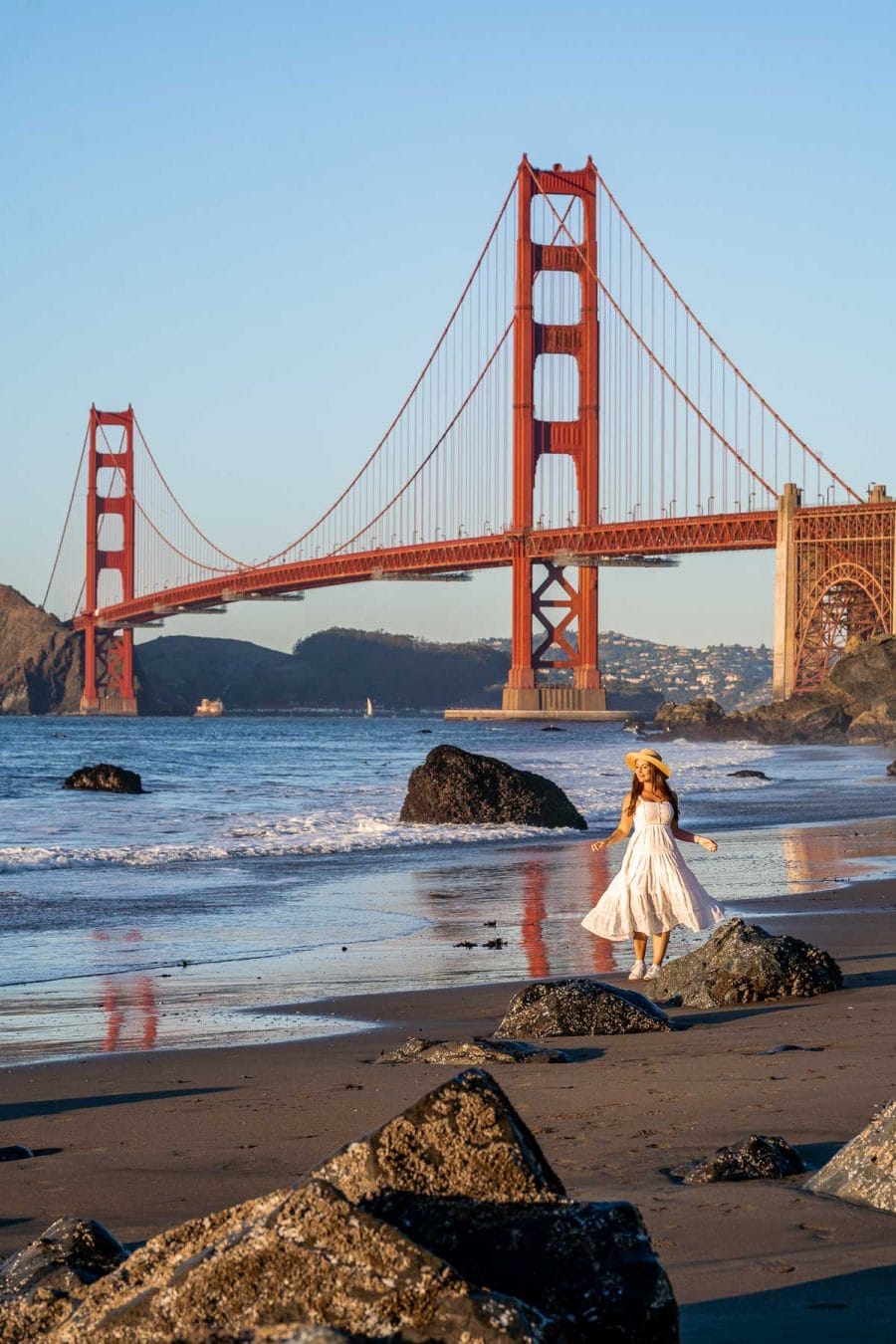 Girl in white dress at Marshall’s Beach in San Francisco