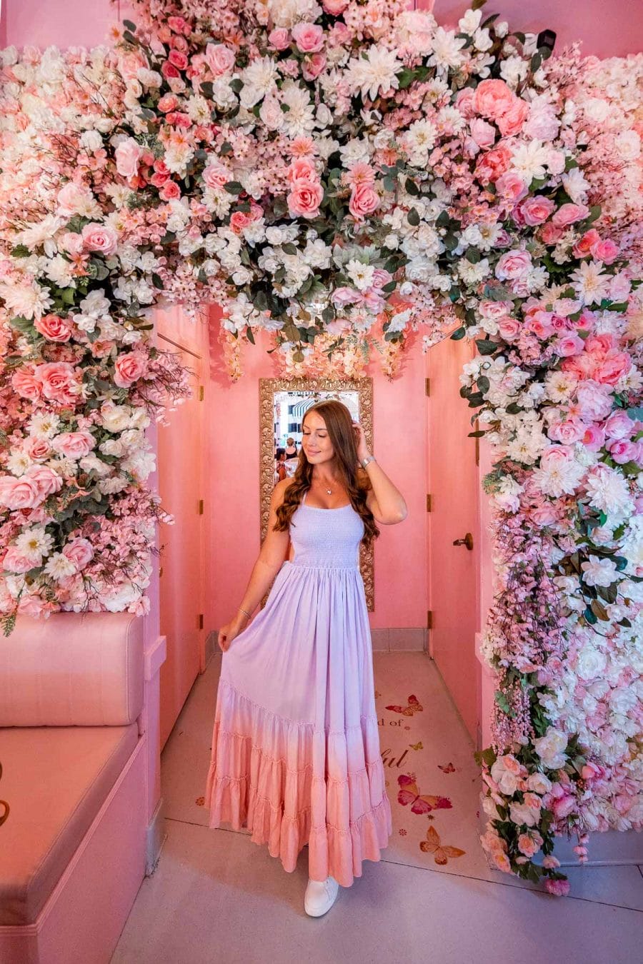 Girl under a floral arch at Mrs Coco in Las Vegas