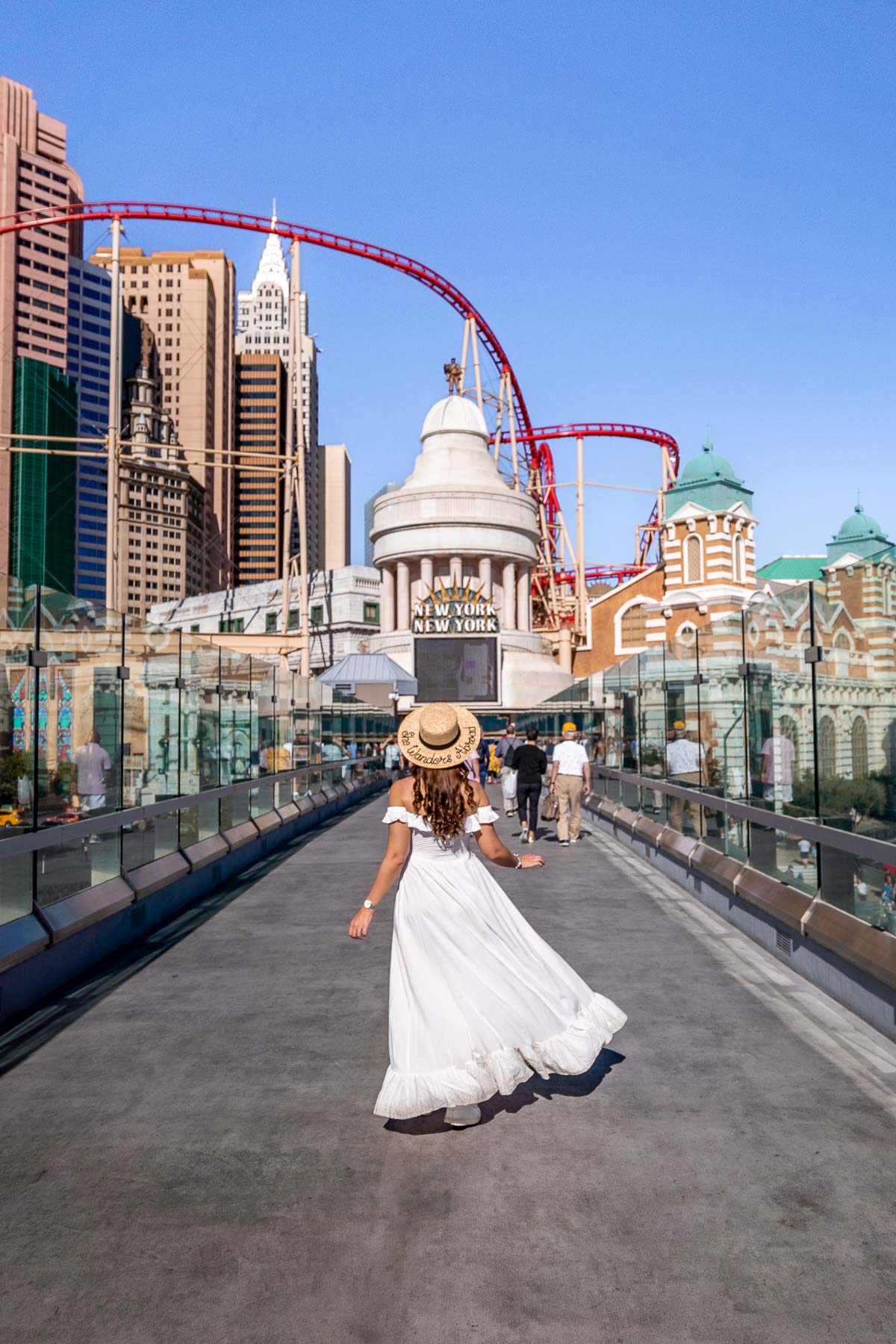 Girl in white dress in front of New York New York in Las Vegas