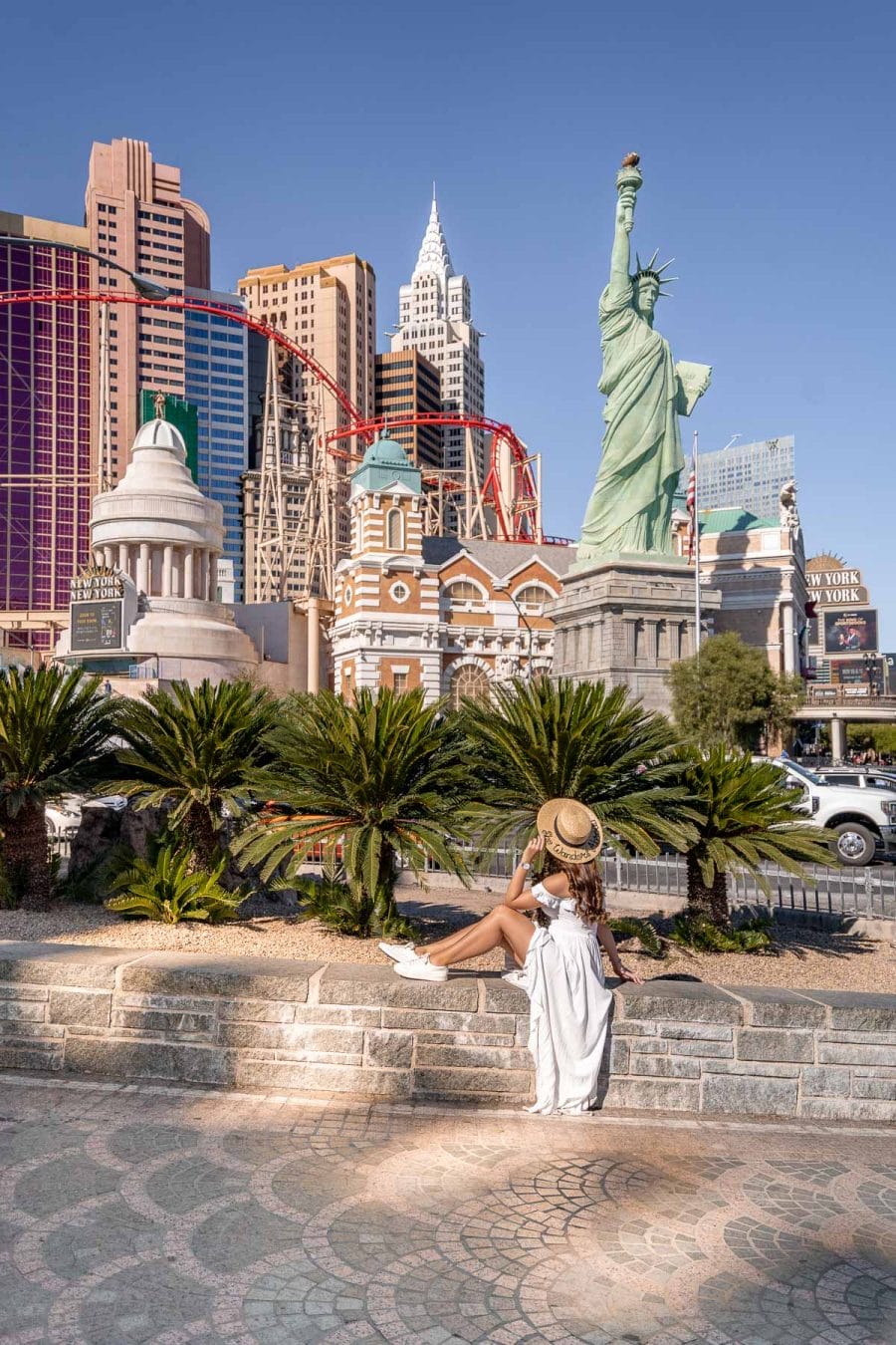 Girl in white dress in front of New York New York in Las Vegas