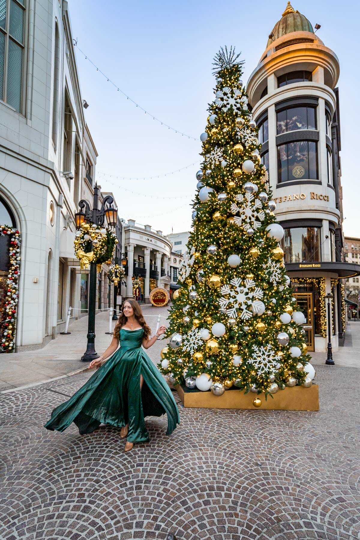 Girl in a green dress at Rodeo Drive at Christmas