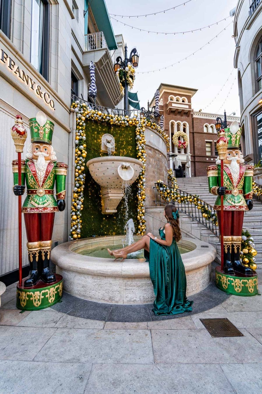 Girl in a green dress at Rodeo Drive at Christmas