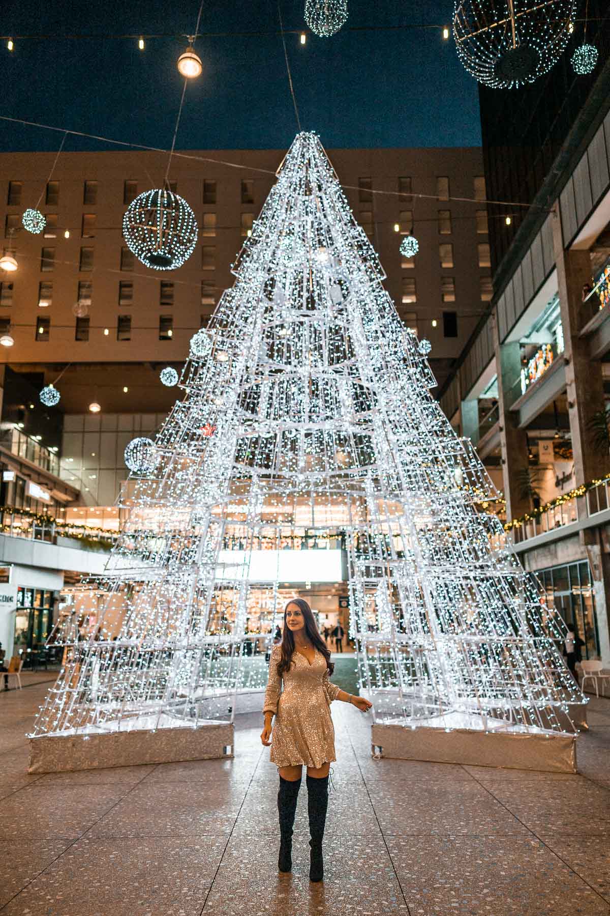 Girl in front of a Christmas tree at The Bloc at DTLA
