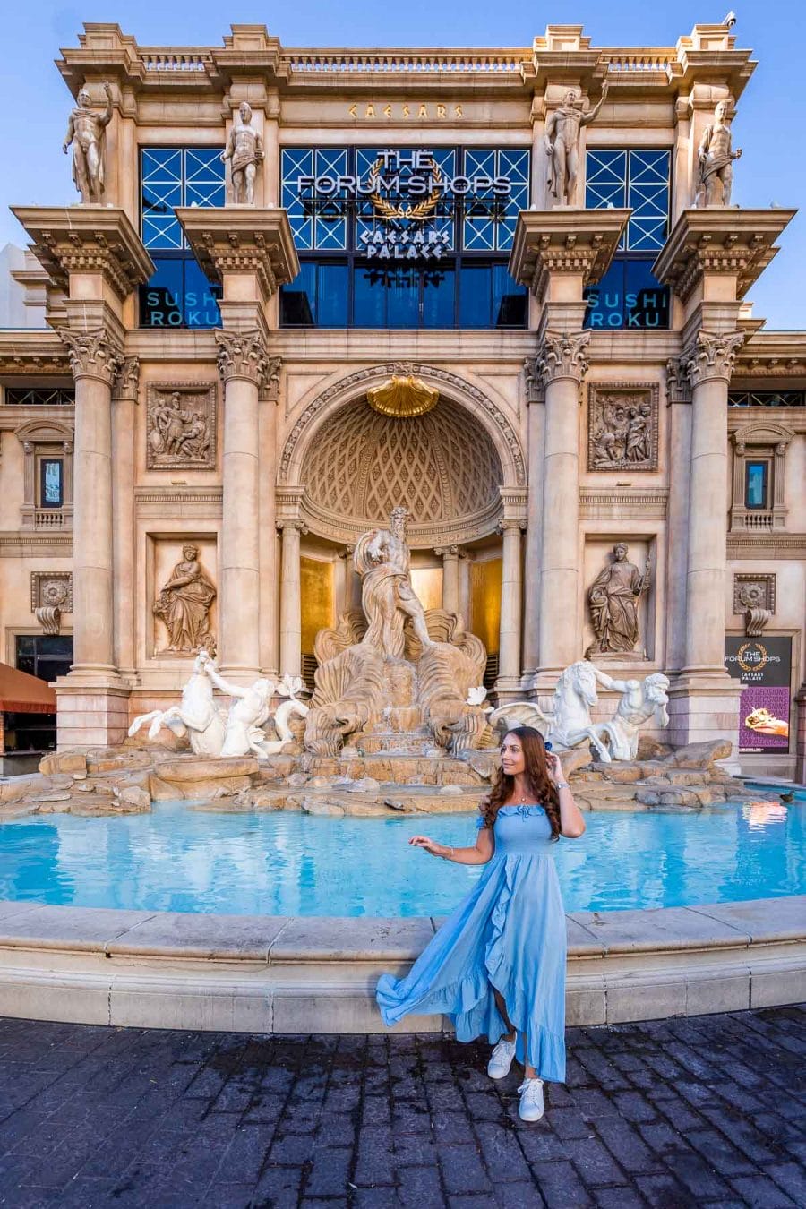 Girl in blue dress in front of the Trevi Fountain at Caesar's Palace in Las Vegas