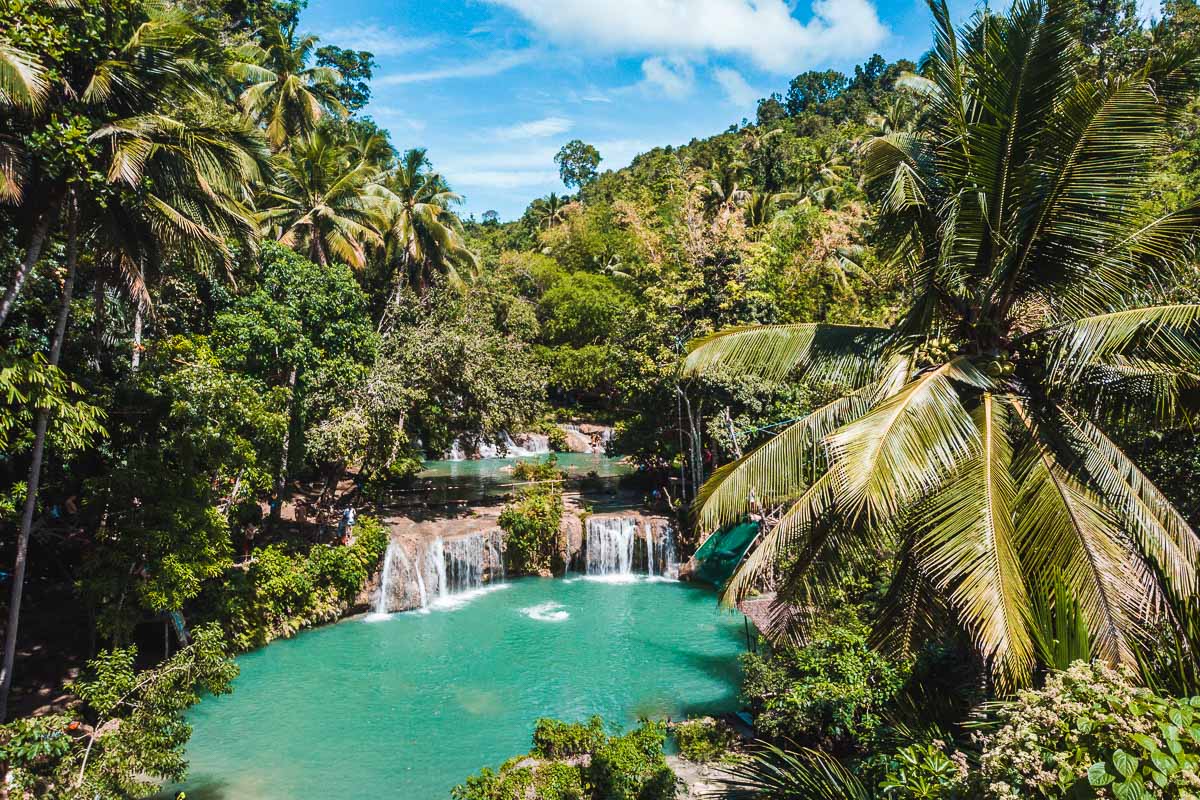 Pristine blue waters at Cambugahay Falls in Siquijor, Philippines