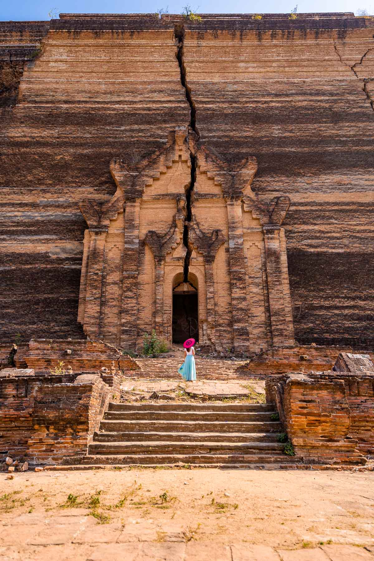 Girl in front of the unfinished pagoda in Myanmar