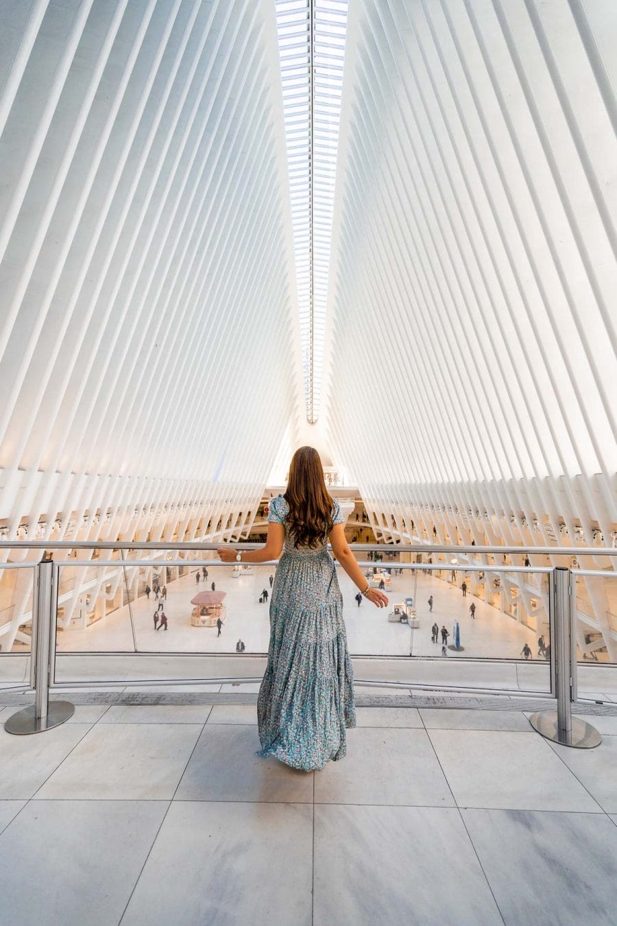 Girl in blue dress inside the Oculus Center in New York