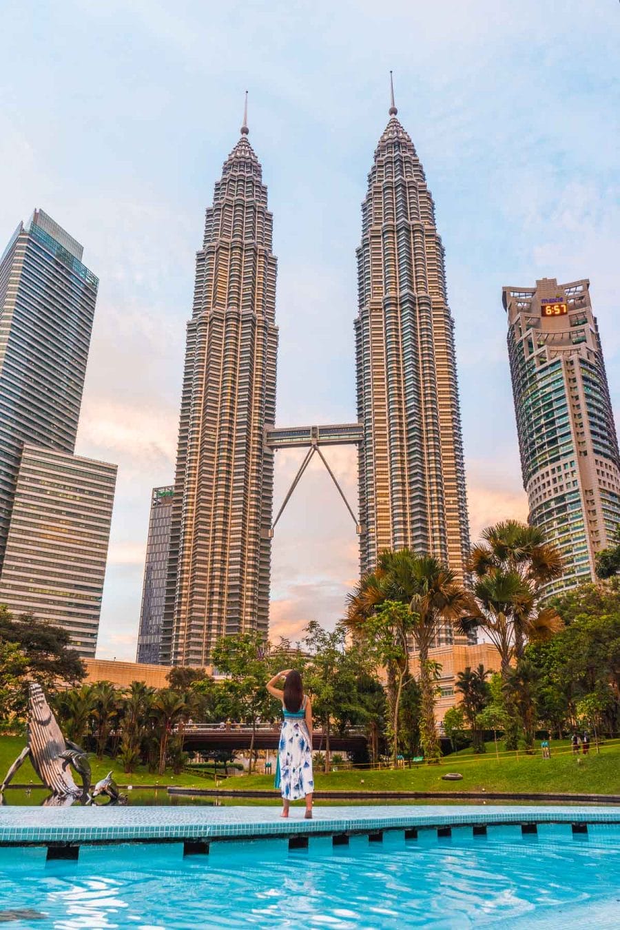 Girl in front of the Petronas Towers in Kuala Lumpur