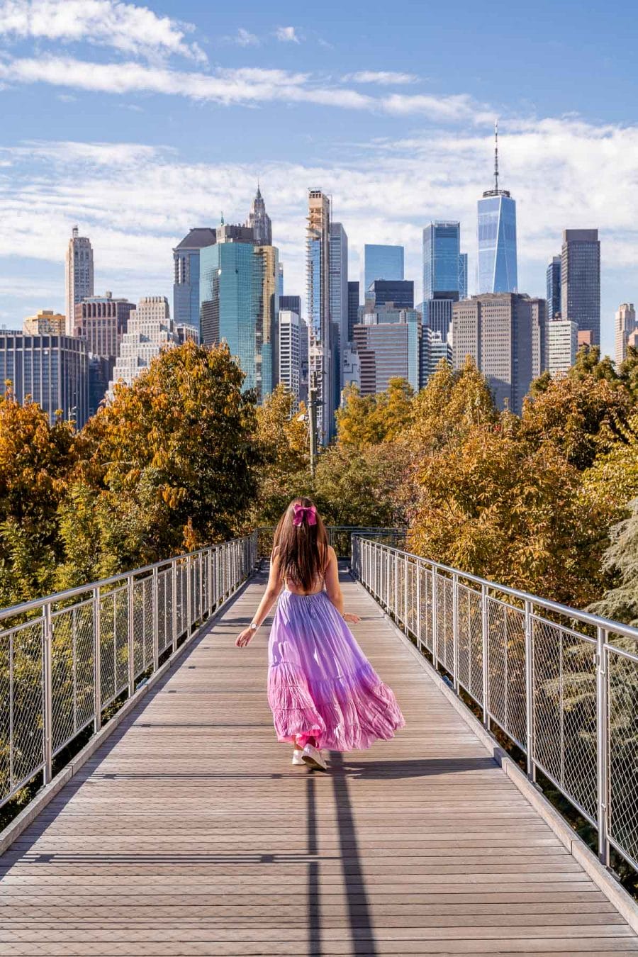 Girl in pink dress on the Squibb Park Bridge in Brooklyn, New York
